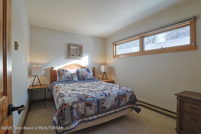 4435 Berry Dr Unit 3611, Wilson, WY 83014 - bedroom with a baseboard radiator, carpet flooring, and a textured ceiling