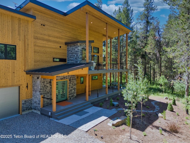 4327 Bridger Rdg, Ashton, ID 83420 - doorway to property with stone siding, french doors, a metal roof, and a standing seam roof