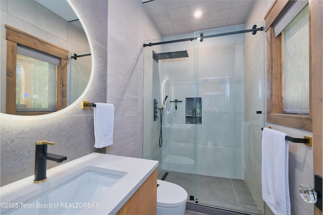 4327 Bridger Rdg, Ashton, ID 83420 - full bath featuring vanity, a shower stall, and tile walls