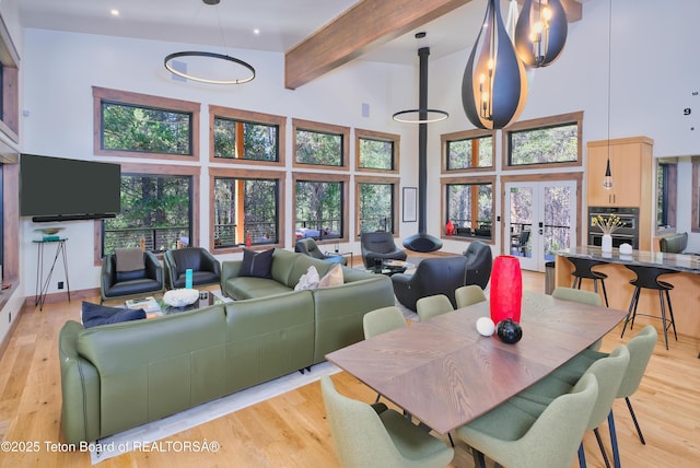 4327 Bridger Rdg, Ashton, ID 83420 - living area with a high ceiling, beamed ceiling, french doors, light wood-type flooring, and recessed lighting