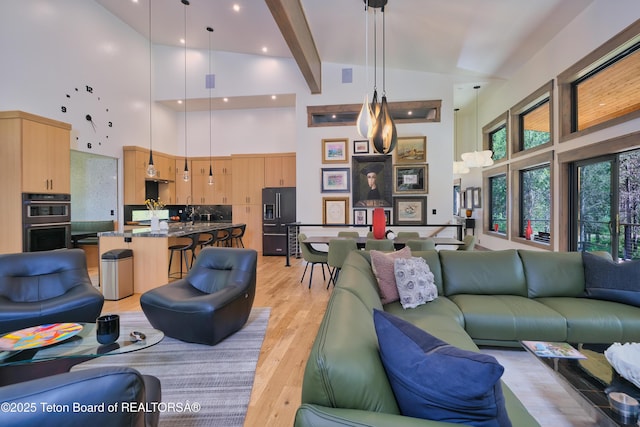 4327 Bridger Rdg, Ashton, ID 83420 - living room with high vaulted ceiling and light wood finished floors