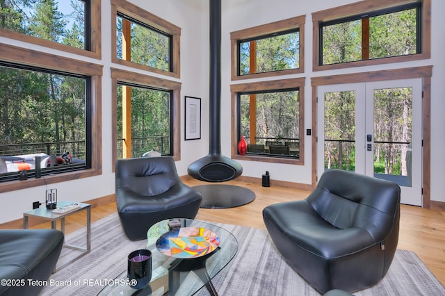 4327 Bridger Rdg, Ashton, ID 83420 - living room with a towering ceiling, french doors, and wood finished floors