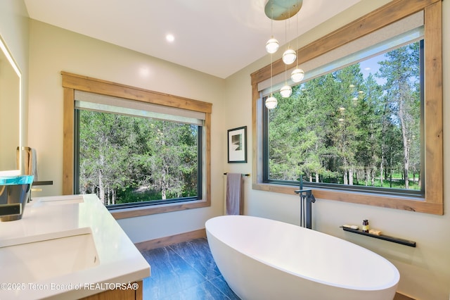 4327 Bridger Rdg, Ashton, ID 83420 - full bathroom with a soaking tub, double vanity, and recessed lighting