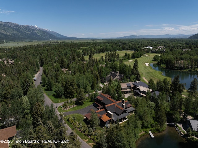 3220 N Teton Pines Dr, Wilson, WY 83014 - aerial view of property and surrounding area featuring a water and mountain view and a heavily wooded area