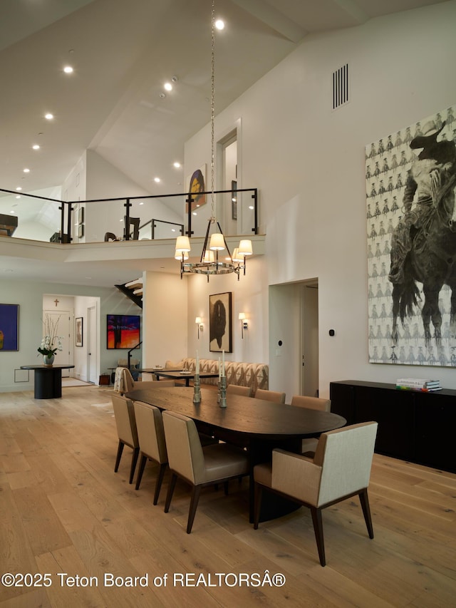 3220 N Teton Pines Dr, Wilson, WY 83014 - dining space featuring high vaulted ceiling, light wood-type flooring, a chandelier, and recessed lighting
