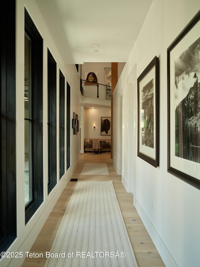 3220 N Teton Pines Dr, Wilson, WY 83014 - hallway featuring light wood-style floors