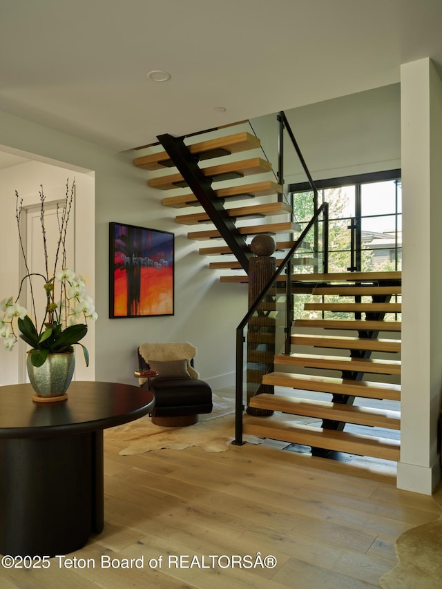 3220 N Teton Pines Dr, Wilson, WY 83014 - staircase featuring wood finished floors