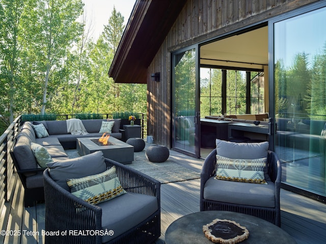 3220 N Teton Pines Dr, Wilson, WY 83014 - wooden terrace featuring an outdoor living space with a fire pit