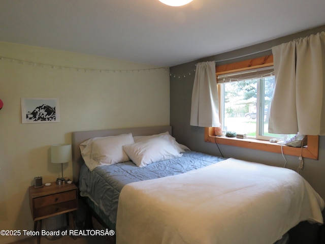 680 E Hall St, Jackson, WY 83001 - bedroom featuring vaulted ceiling