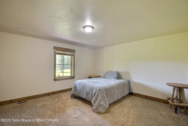 2160 Tomahawk Trl, Victor, ID 83455 - bedroom with light colored carpet and baseboards