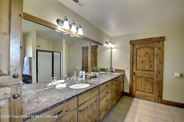 2160 Tomahawk Trl, Victor, ID 83455 - bathroom with double vanity, tile patterned floors, and a shower stall