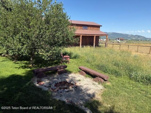 2160 Tomahawk Trl, Victor, ID 83455 - view of yard featuring an outdoor fire pit
