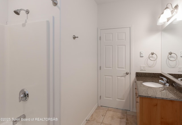 80 Eva Ln Unit 14, Victor, ID 83455 - bathroom featuring vanity, tile patterned flooring, and a shower