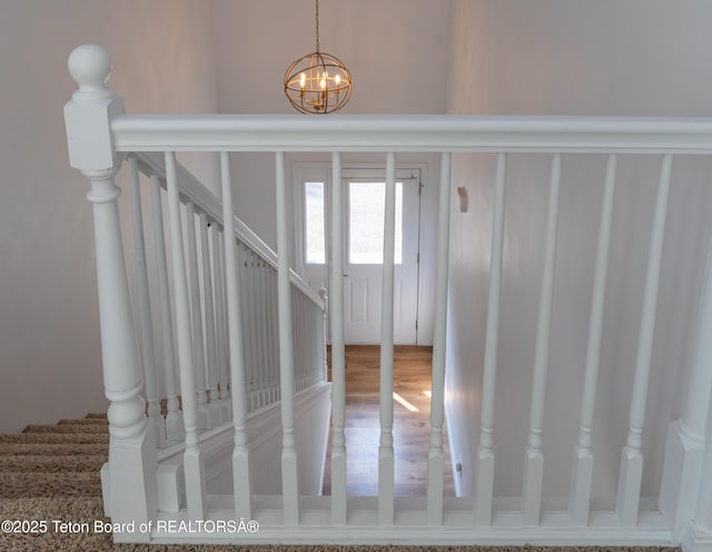 80 Eva Ln Unit 14, Victor, ID 83455 - stairway with a chandelier and wood finished floors