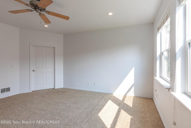 80 Eva Ln Unit 14, Victor, ID 83455 - empty room featuring healthy amount of natural light, light colored carpet, recessed lighting, and ceiling fan