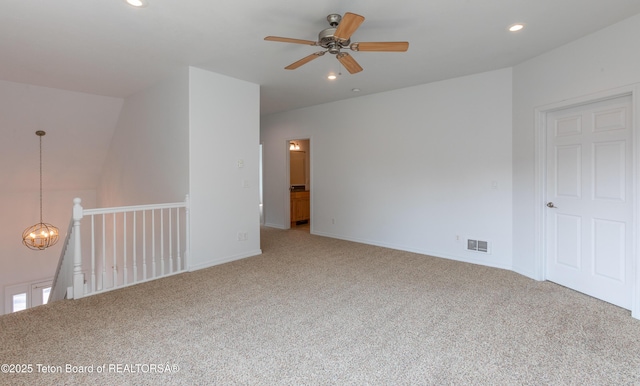 80 Eva Ln Unit 14, Victor, ID 83455 - unfurnished room with light colored carpet, a ceiling fan, recessed lighting, and a chandelier