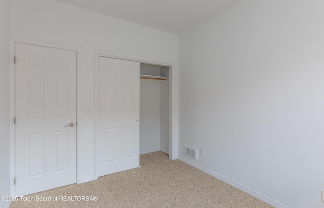 80 Eva Ln Unit 14, Victor, ID 83455 - unfurnished bedroom featuring light colored carpet and a closet