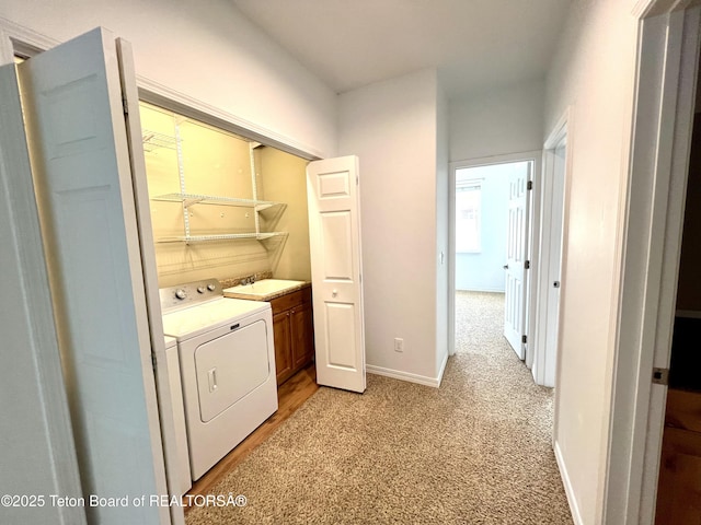 80 Eva Ln Unit 14, Victor, ID 83455 - washroom featuring washing machine and clothes dryer and light carpet