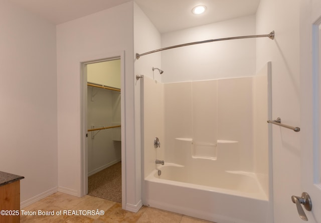 80 Eva Ln Unit 14, Victor, ID 83455 - bathroom featuring bathtub / shower combination, tile patterned flooring, vanity, a spacious closet, and recessed lighting