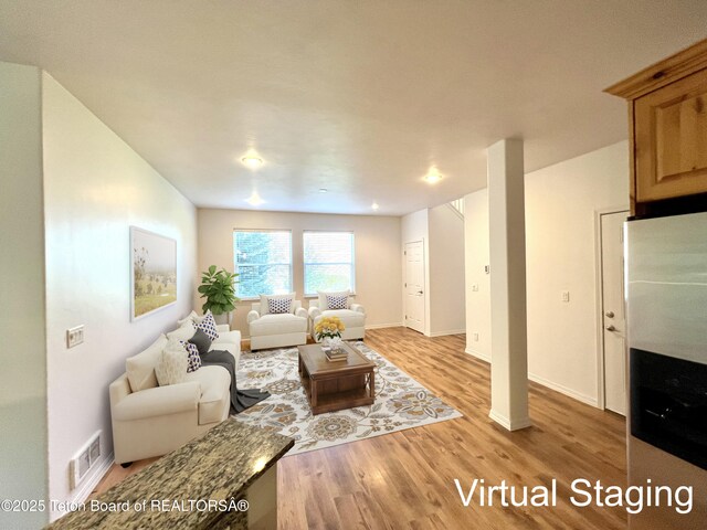 80 Eva Ln Unit 14, Victor, ID 83455 - living room featuring light wood-style floors and baseboards