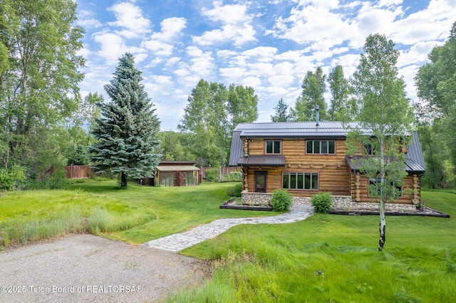 3760 N Moose-Wilson Rd, Wilson, WY 83014 - back of property with log siding, a metal roof, and a standing seam roof
