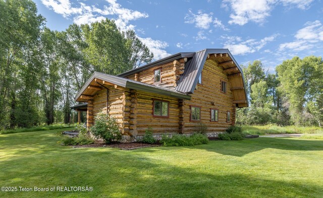 3760 N Moose-Wilson Rd, Wilson, WY 83014 - view of property exterior featuring log exterior, a yard, a metal roof, and a gambrel roof