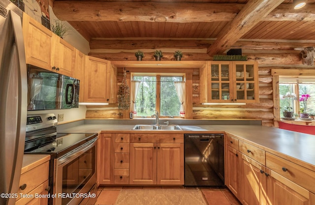 3760 N Moose-Wilson Rd, Wilson, WY 83014 - kitchen with black appliances, a wood ceiling with exposed beams, log walls, light countertops, and glass insert cabinets