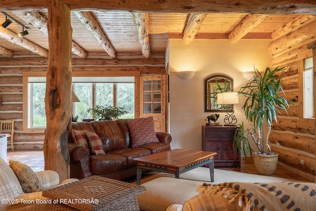 3760 N Moose-Wilson Rd, Wilson, WY 83014 - living room with rustic walls, a wood ceiling with exposed beams, and hardwood / wood-style flooring