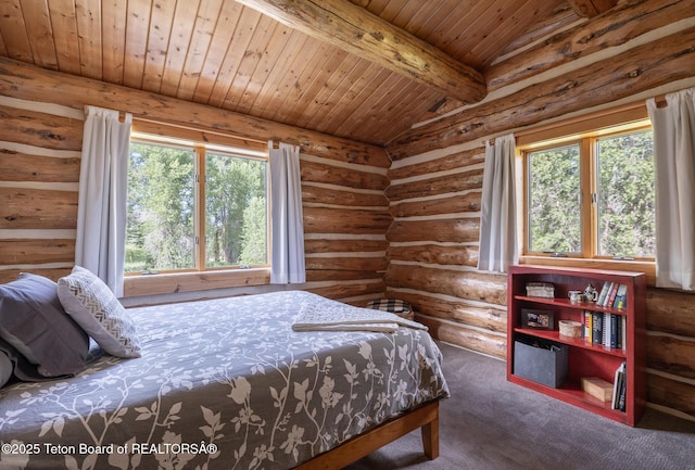 3760 N Moose-Wilson Rd, Wilson, WY 83014 - bedroom featuring multiple windows, wood ceiling, carpet floors, and log walls