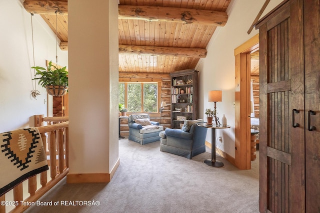 3760 N Moose-Wilson Rd, Wilson, WY 83014 - carpeted living room featuring a wood ceiling with exposed beams and baseboards