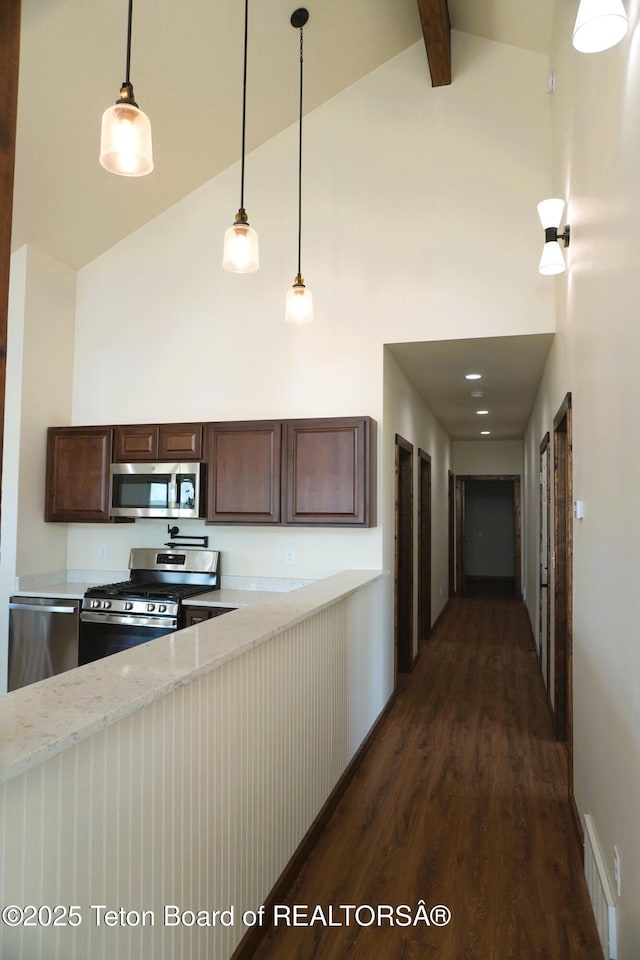 1350 Arroyo, Pinedale, WY 82941 - kitchen featuring stainless steel appliances, high vaulted ceiling, dark wood finished floors, dark brown cabinets, and beamed ceiling