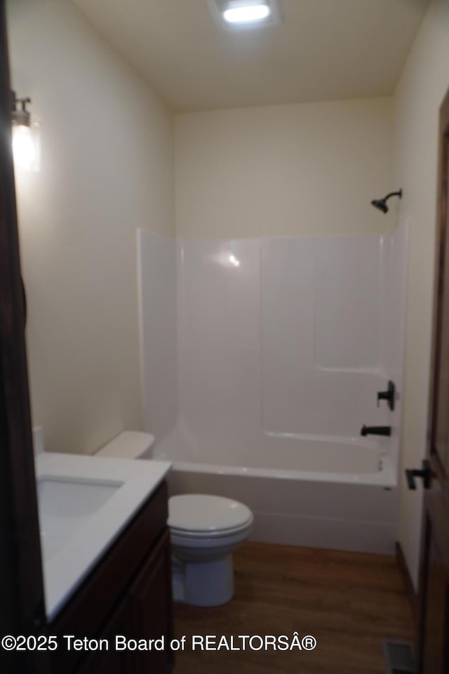 1350 Arroyo, Pinedale, WY 82941 - full bath with vanity, wood finished floors, and bathtub / shower combination