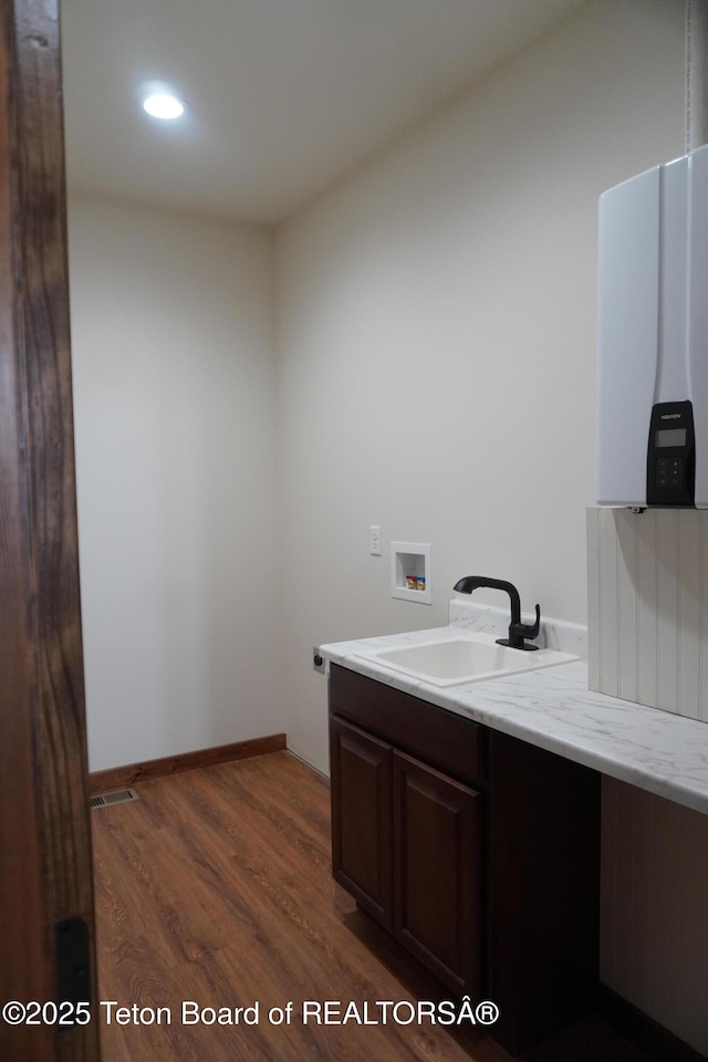 1350 Arroyo, Pinedale, WY 82941 - bathroom with wood finished floors, vanity, and recessed lighting