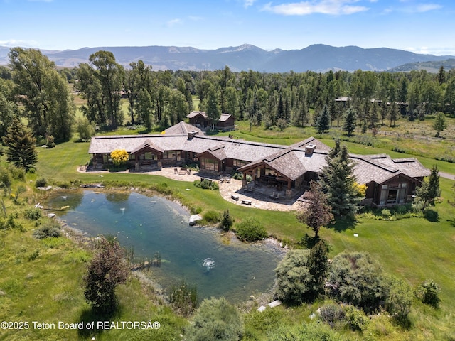 500 E Buckwheat Cir, Jackson, WY 83001 - aerial view of property and surrounding area featuring a water and mountain view and a heavily wooded area