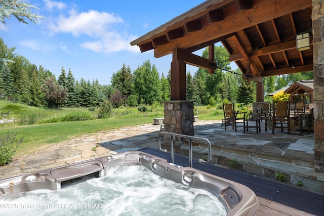 500 E Buckwheat Cir, Jackson, WY 83001 - view of patio / terrace with a hot tub and a gazebo