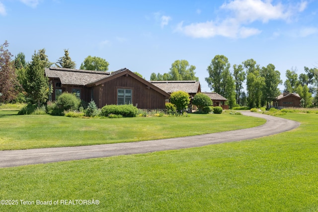 500 E Buckwheat Cir, Jackson, WY 83001 - view of side of property with a lawn