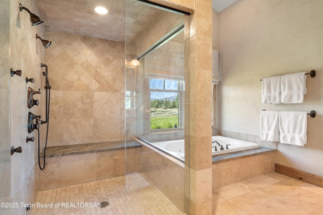500 E Buckwheat Cir, Jackson, WY 83001 - bathroom featuring a garden tub, a tile shower, and tile patterned flooring
