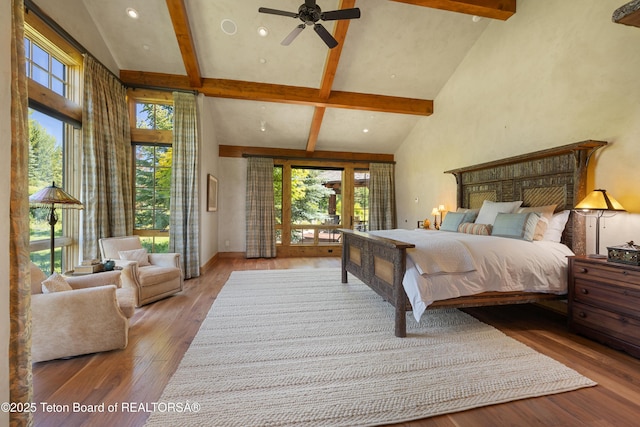 500 E Buckwheat Cir, Jackson, WY 83001 - bedroom with high vaulted ceiling, beam ceiling, wood finished floors, recessed lighting, and access to exterior