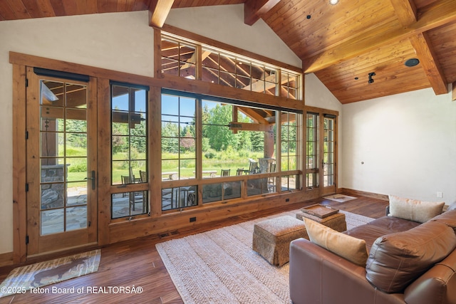 500 E Buckwheat Cir, Jackson, WY 83001 - living area featuring hardwood / wood-style flooring, a wooden ceiling with exposed beams, and high vaulted ceiling