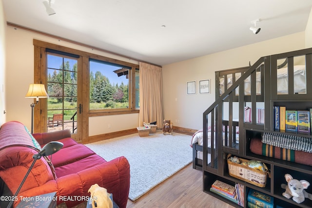 500 E Buckwheat Cir, Jackson, WY 83001 - living area featuring wood finished floors and stairway