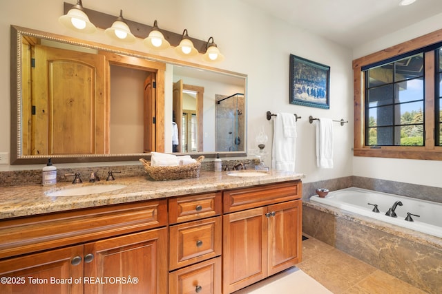 500 E Buckwheat Cir, Jackson, WY 83001 - bathroom with a garden tub, double vanity, and a stall shower