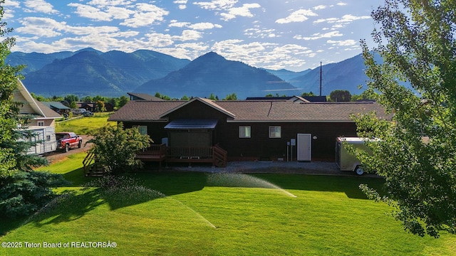 158 Holly Dr, Star Valley Ranch, WY 83127 - back of property featuring a deck with mountain view and a yard