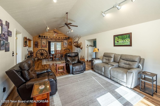 158 Holly Dr, Star Valley Ranch, WY 83127 - living room with wood finished floors, ceiling fan, track lighting, and lofted ceiling