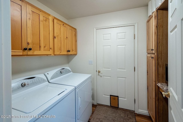 158 Holly Dr, Star Valley Ranch, WY 83127 - laundry room with washing machine and dryer, cabinet space, and dark wood-style floors