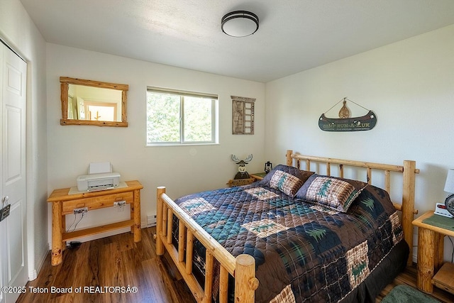 158 Holly Dr, Star Valley Ranch, WY 83127 - bedroom with wood finished floors and baseboards
