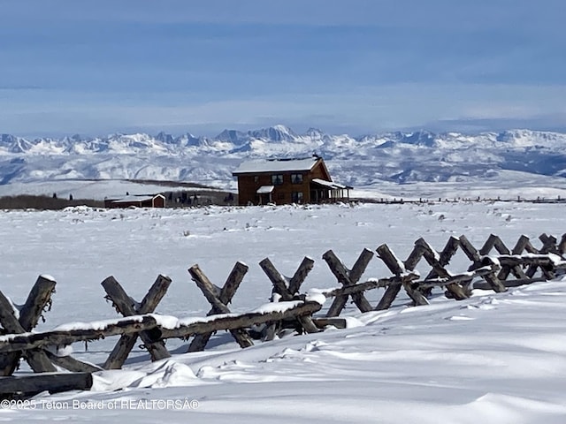 109 E Fontenelle Dr, Daniel, WY 83115 - yard covered in snow with a mountain view