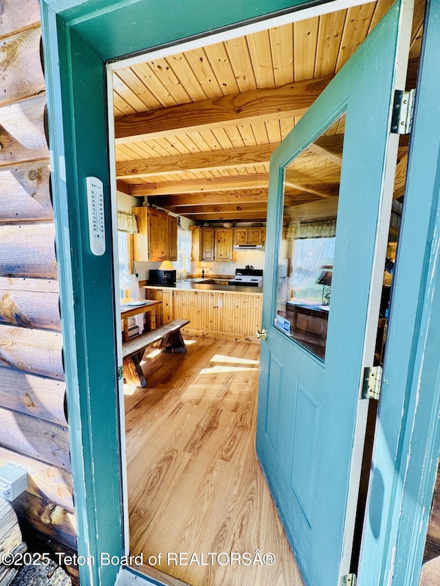 109 E Fontenelle Dr, Daniel, WY 83115 - kitchen with a wood ceiling with exposed beams, light wood-type flooring, and stainless steel countertops