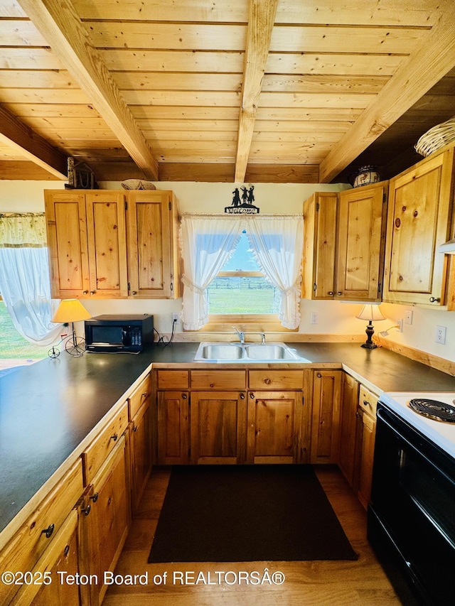 109 E Fontenelle Dr, Daniel, WY 83115 - kitchen with black appliances, a wood ceiling with exposed beams, dark wood-type flooring, and brown cabinets