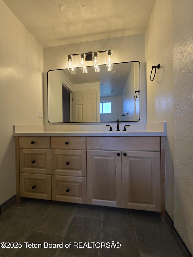 6270 S 3rd St, Tetonia, ID 83452 - bathroom with vanity, tile patterned flooring, and a textured wall
