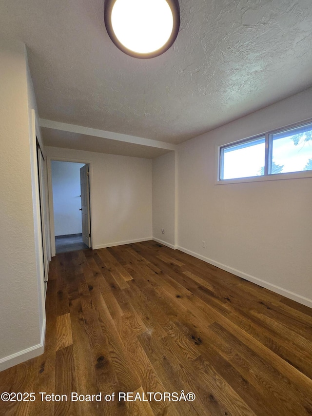 6270 S 3rd St, Tetonia, ID 83452 - empty room with dark wood-type flooring and a textured ceiling